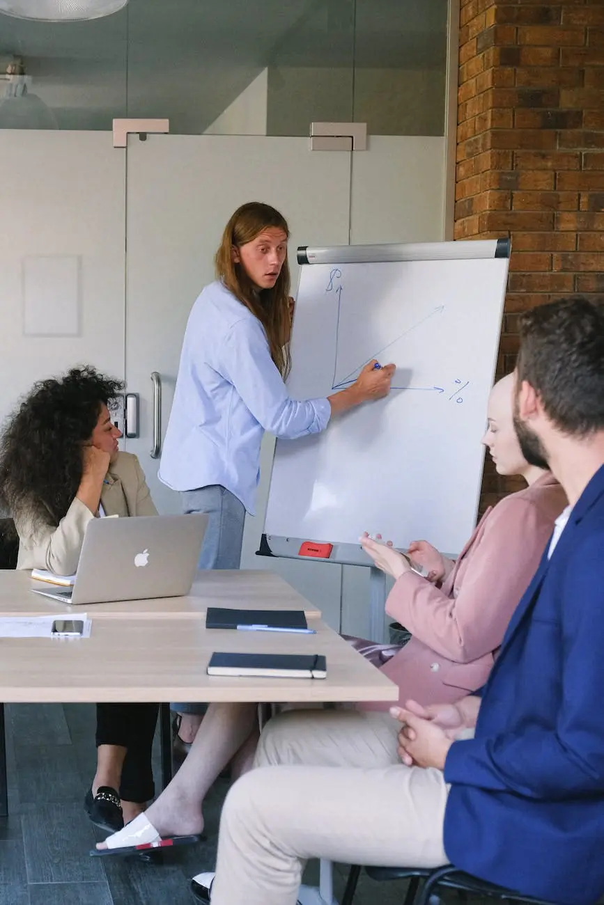 employee drawing graph on flipchart during meeting in workspace about welcome bonus