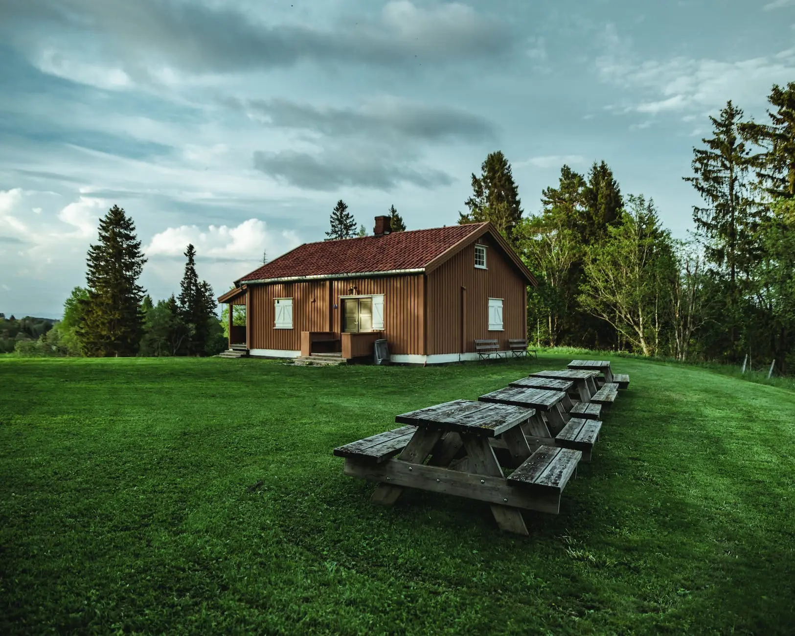 brown wooden house near trees