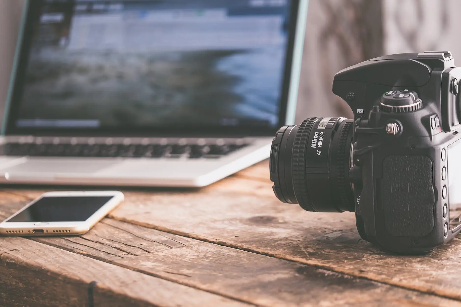 black dslr camera on beige wooden surface for video intro maker