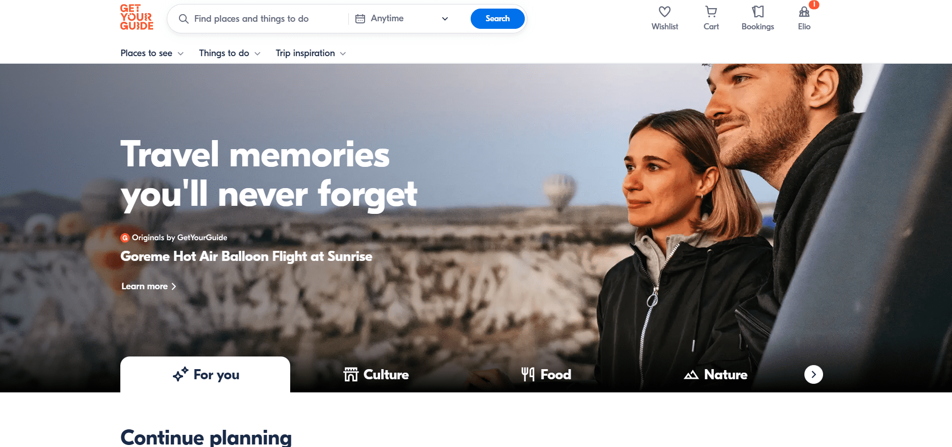 An inviting travel-themed webpage featuring a couple enjoying a scenic view, with hot air balloons floating in the background, promoting unforgettable travel experiences.