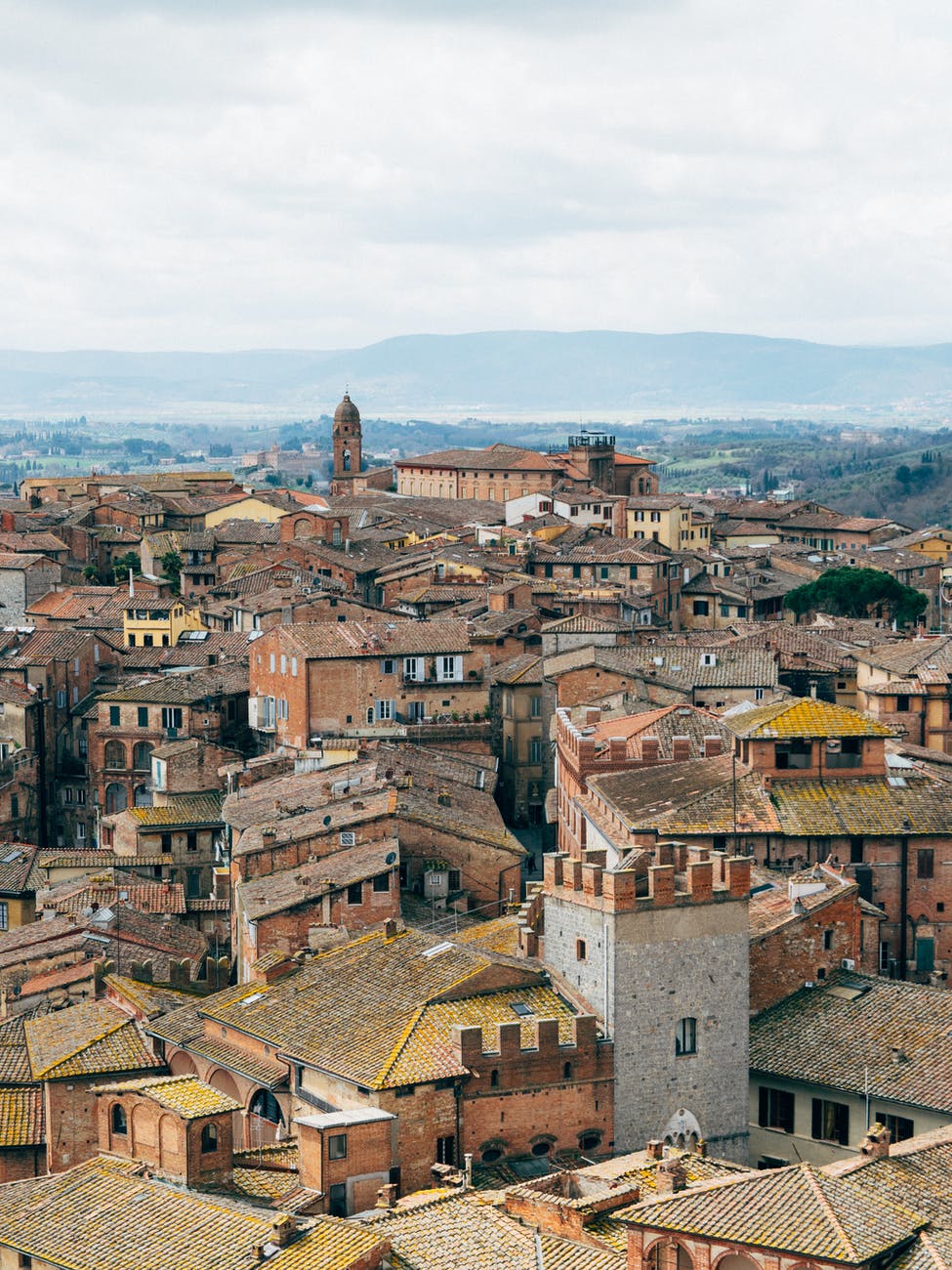 photo of brown and gray buildings - 1 euro homes for sale listings 2025