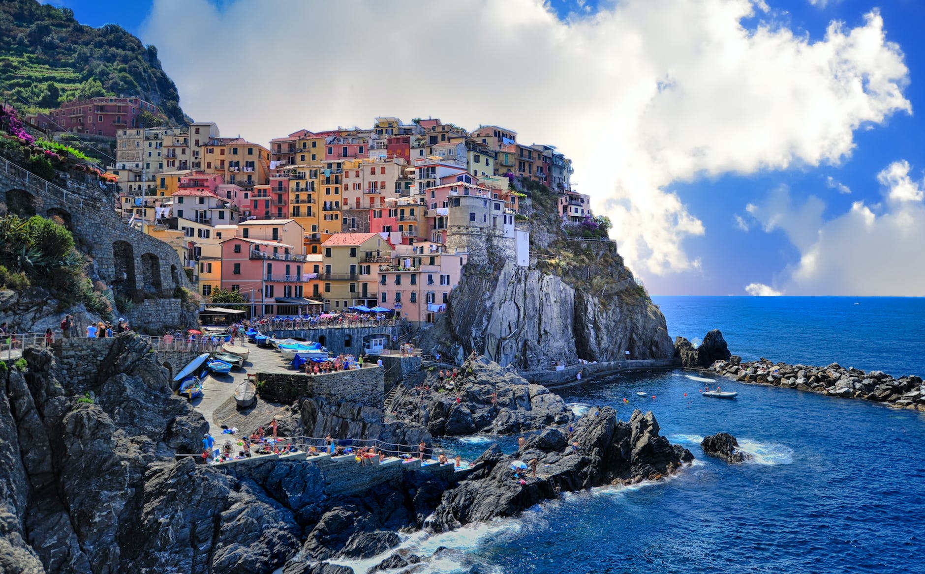 Assorted color houses beside body of water