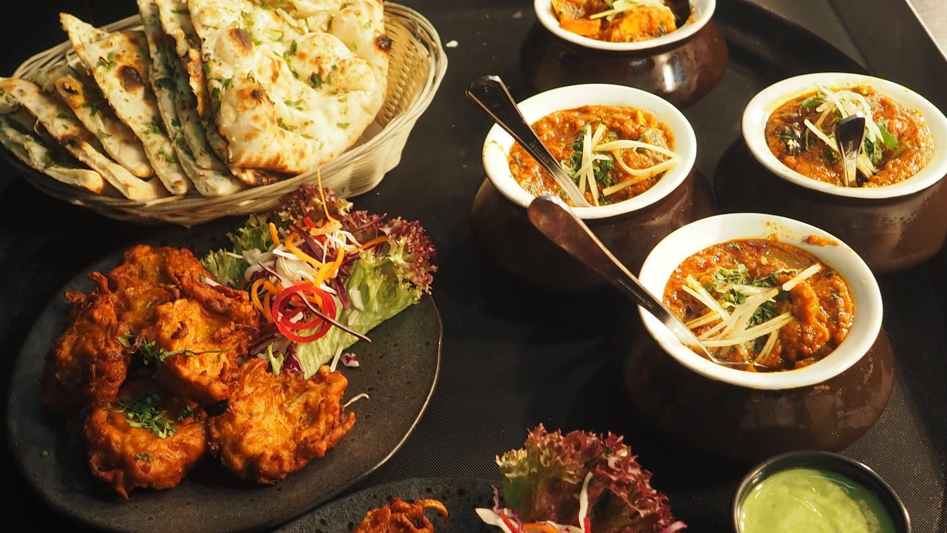 white and brown cooked dish on white ceramic bowls International flavors in Oslo Norway rental car guide