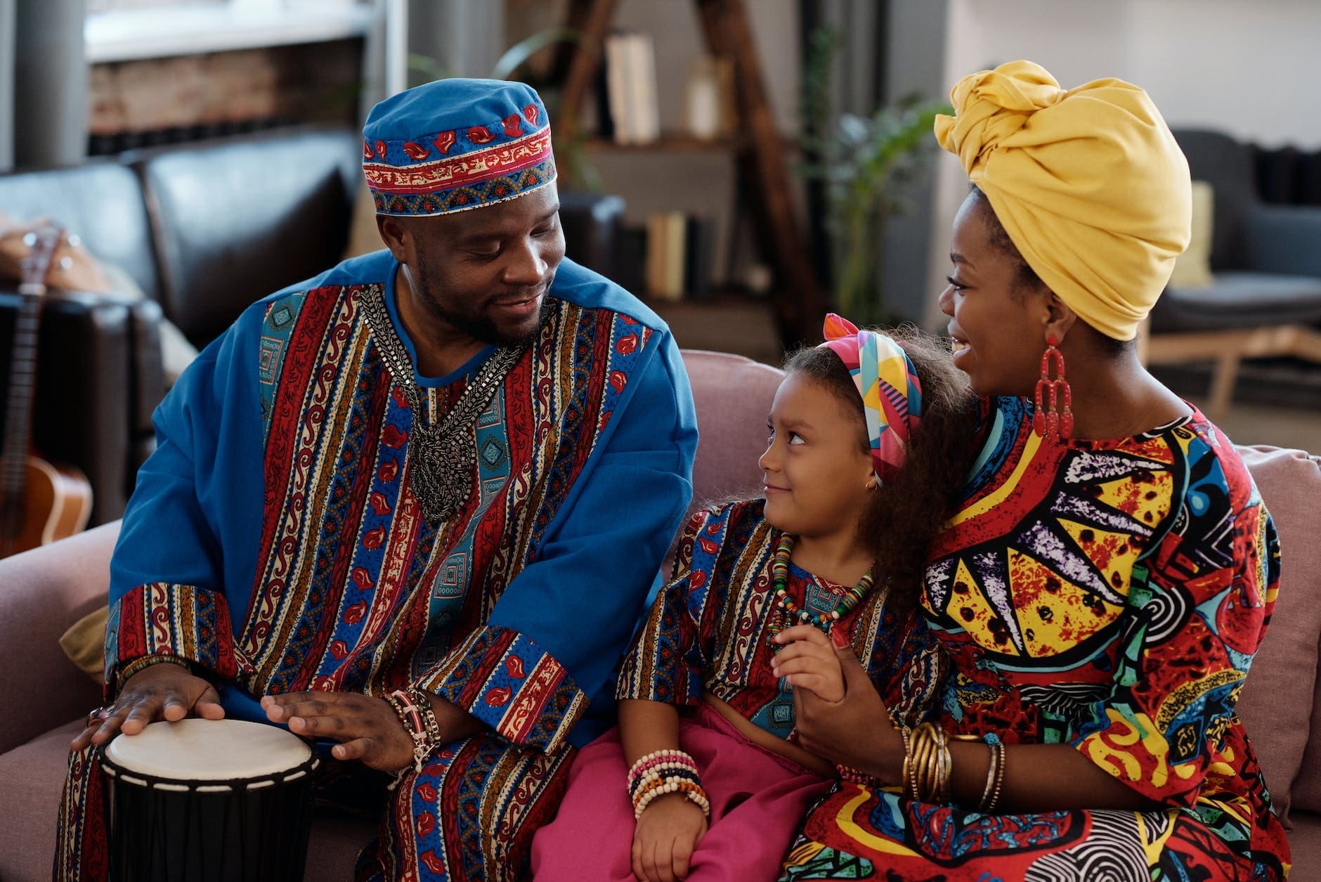 photo of man playing djembe
