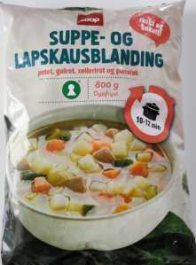 In a heavy baking tray add sliced potato, carrot and celery