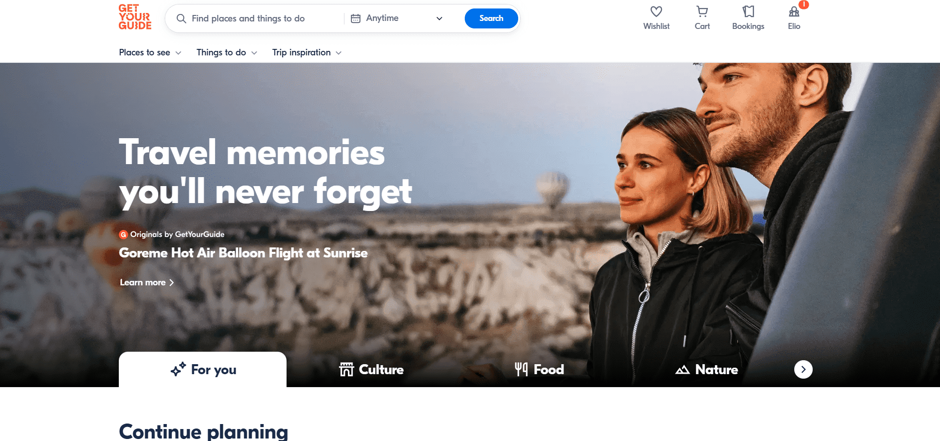 An inviting travel-themed webpage featuring a couple enjoying a scenic view, with hot air balloons floating in the background, promoting unforgettable travel experiences.